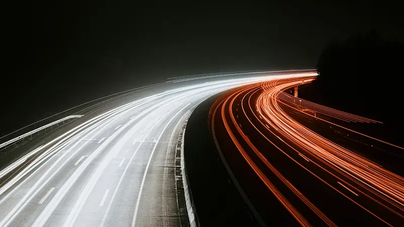 Long-exposure photograph of a highway at night