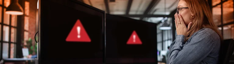 A woman notices an error message appear on her screen.