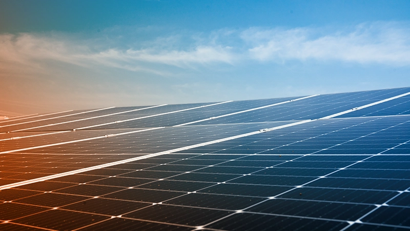 an unobstructed view of high-tech solar panels under a clear blue sky.